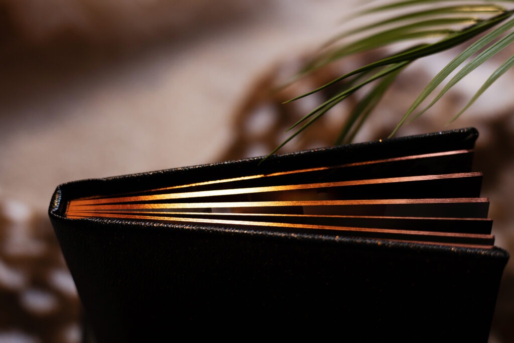 A gorgeous luxury boudoir album featuring Dark Ambar gilding